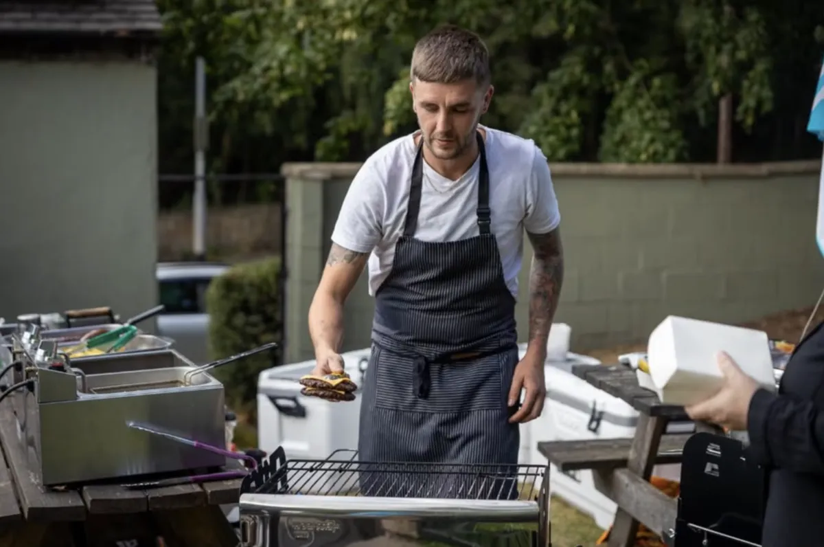 Chef grilling gyros at a STREET outdoor setup